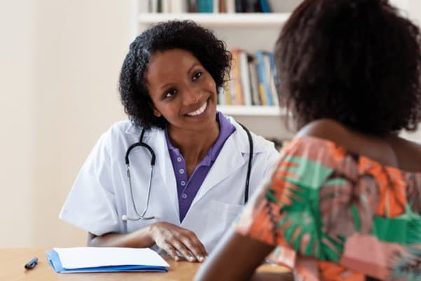 Doctor consulting with a patient about symptoms